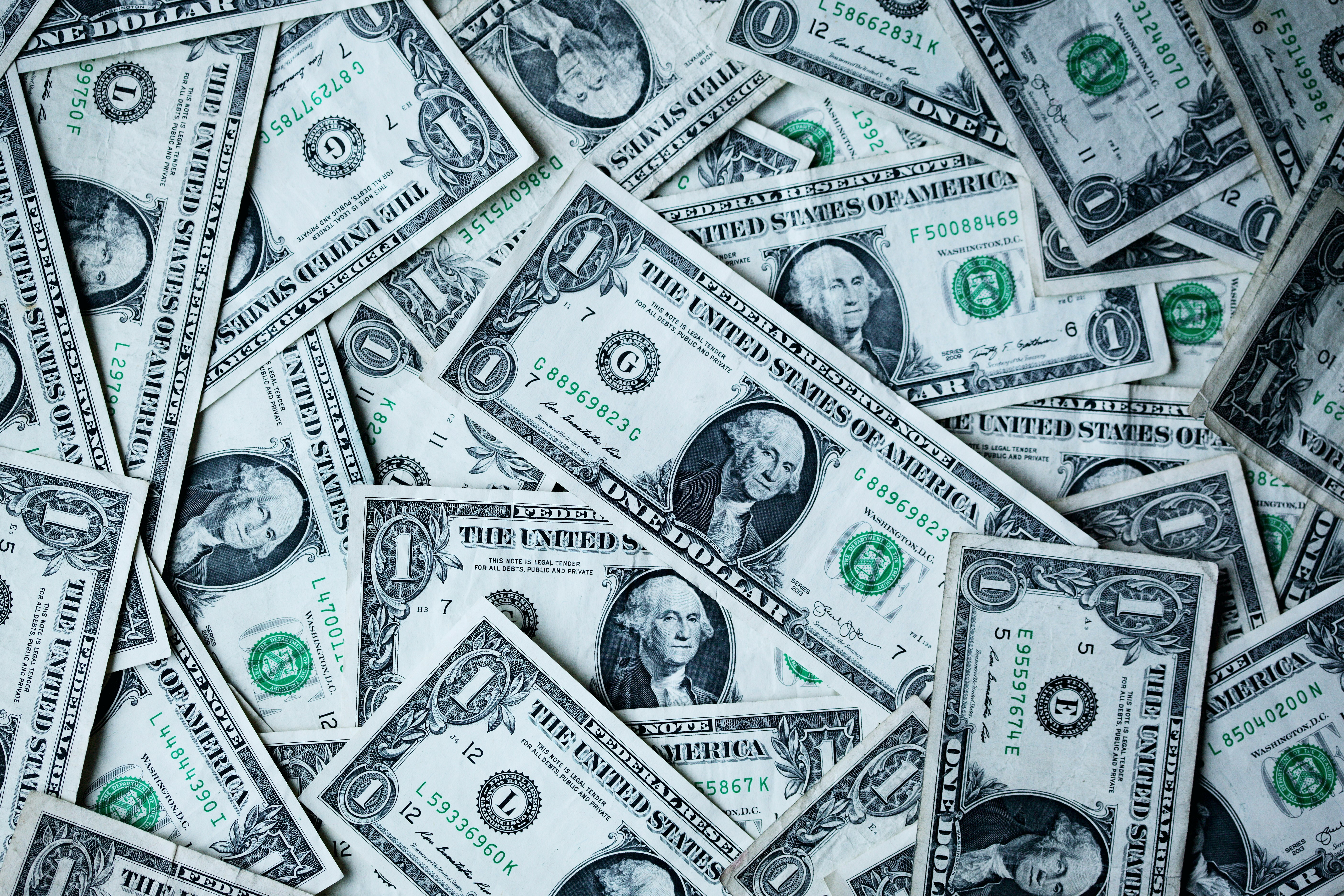 Photograph of US $1 bills in a pile